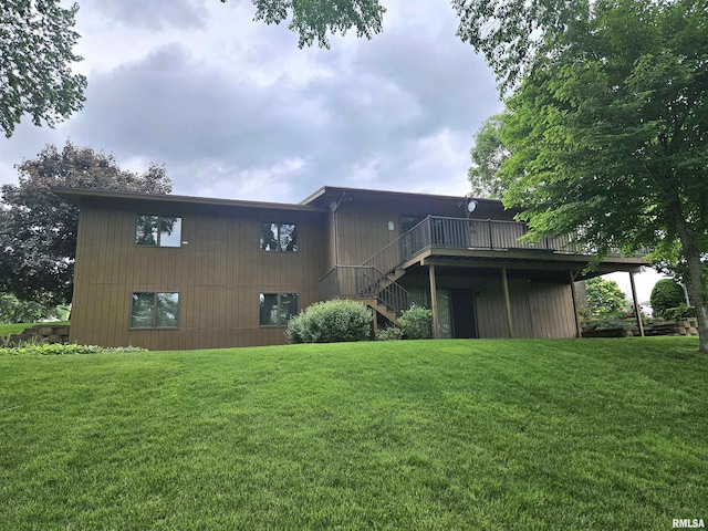 2120 Fareway Dr, Muscatine, IA 52761 - rear view of property with stairs, a deck, and a lawn