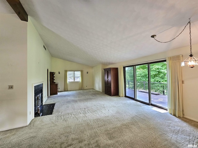 2120 Fareway Dr, Muscatine, IA 52761 - unfurnished living room with light colored carpet, lofted ceiling, baseboards, and a fireplace with flush hearth