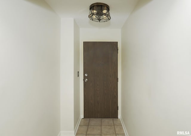 1360 Kimberly Ridge Rd Unit 313, Bettendorf, IA 52722 - doorway featuring baseboards and light tile patterned floors