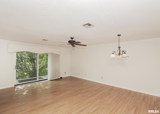 1360 Kimberly Ridge Rd Unit 313, Bettendorf, IA 52722 - empty room featuring light wood finished floors, a ceiling fan, ornamental molding, a chandelier, and a textured ceiling