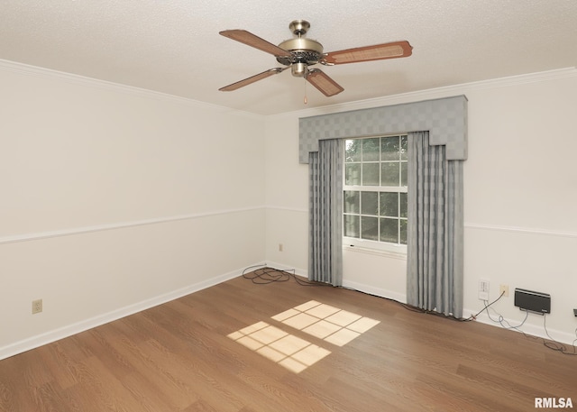 1360 Kimberly Ridge Rd Unit 313, Bettendorf, IA 52722 - unfurnished room featuring wood finished floors, crown molding, ceiling fan, and a textured ceiling