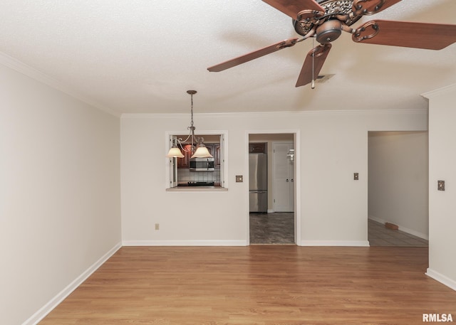 1360 Kimberly Ridge Rd Unit 313, Bettendorf, IA 52722 - empty room with a ceiling fan, crown molding, and light wood-style flooring
