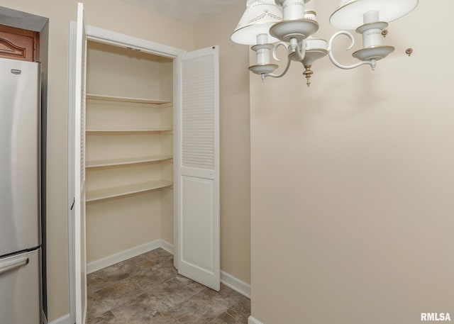 1360 Kimberly Ridge Rd Unit 313, Bettendorf, IA 52722 - spacious closet featuring a chandelier
