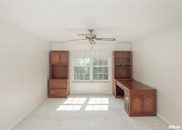 1360 Kimberly Ridge Rd Unit 313, Bettendorf, IA 52722 - unfurnished office featuring wallpapered walls, ceiling fan, and light colored carpet