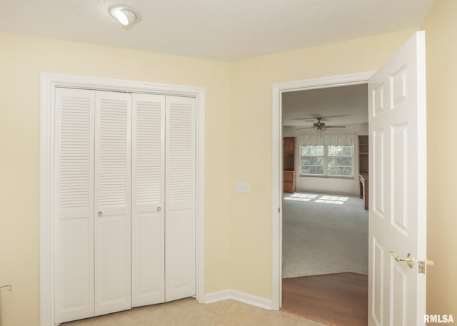 1360 Kimberly Ridge Rd Unit 313, Bettendorf, IA 52722 - unfurnished bedroom featuring a closet and light colored carpet