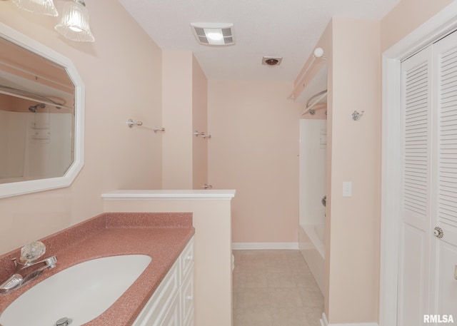 1360 Kimberly Ridge Rd Unit 313, Bettendorf, IA 52722 - full bathroom featuring a closet, vanity,  shower combination, and tile patterned flooring