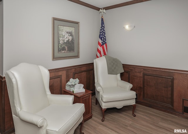 1360 Kimberly Ridge Rd Unit 313, Bettendorf, IA 52722 - living area featuring ornamental molding and light wood-style flooring
