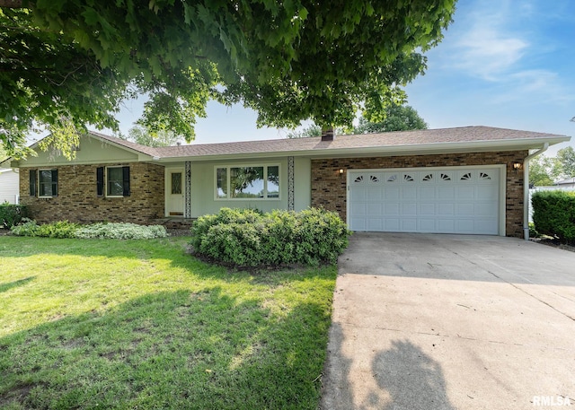 1523 7th St, Orion, IL 61273 - ranch-style home with a front yard, driveway, a garage, and brick siding