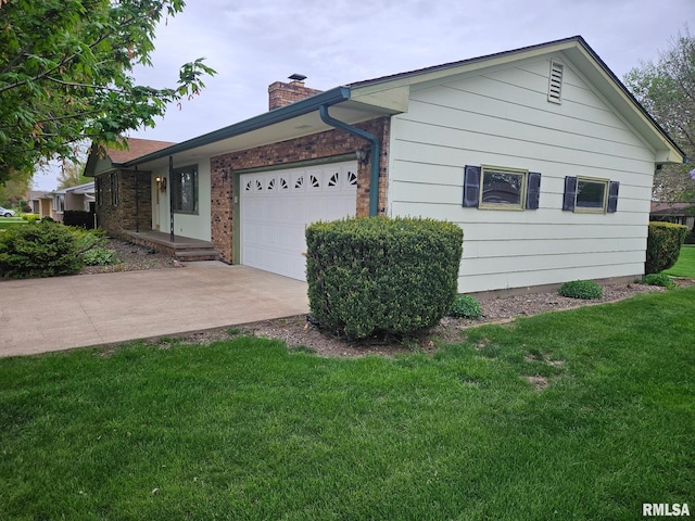 1523 7th St, Orion, IL 61273 - view of front of house with a chimney, a garage, a front lawn, driveway, and brick siding