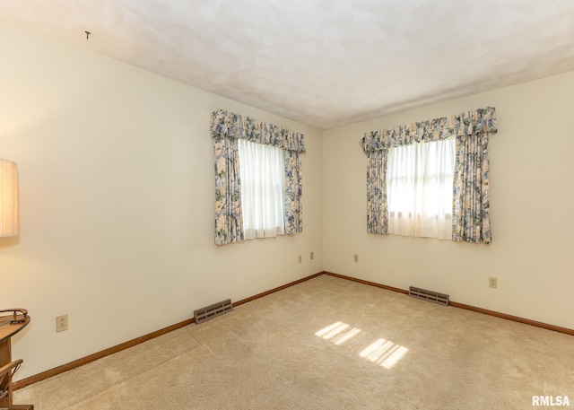 1523 7th St, Orion, IL 61273 - carpeted empty room with plenty of natural light and baseboards