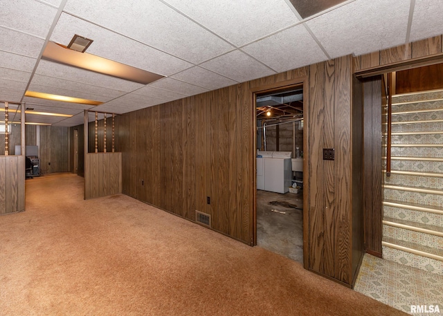 1523 7th St, Orion, IL 61273 - finished basement featuring stairway, a drop ceiling, wooden walls, carpet flooring, and washer and clothes dryer