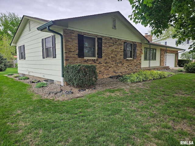 1523 7th St, Orion, IL 61273 - view of front of property featuring a garage, a front lawn, and brick siding