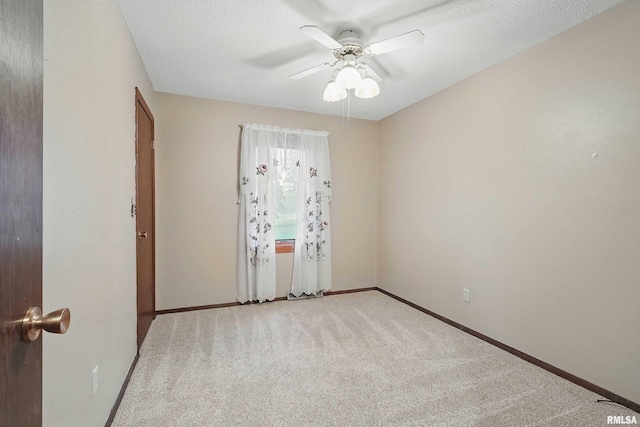803 Locust St, Princeton, IA 52768 - unfurnished room with light carpet, a ceiling fan, and baseboards
