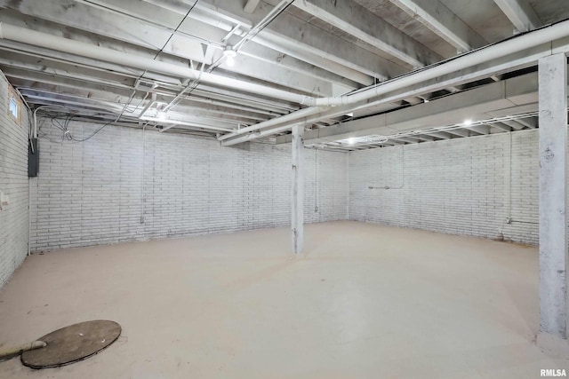 803 Locust St, Princeton, IA 52768 - unfinished basement featuring brick wall