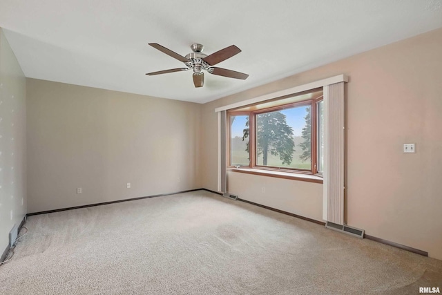 803 Locust St, Princeton, IA 52768 - unfurnished room with ceiling fan, carpet floors, and baseboards