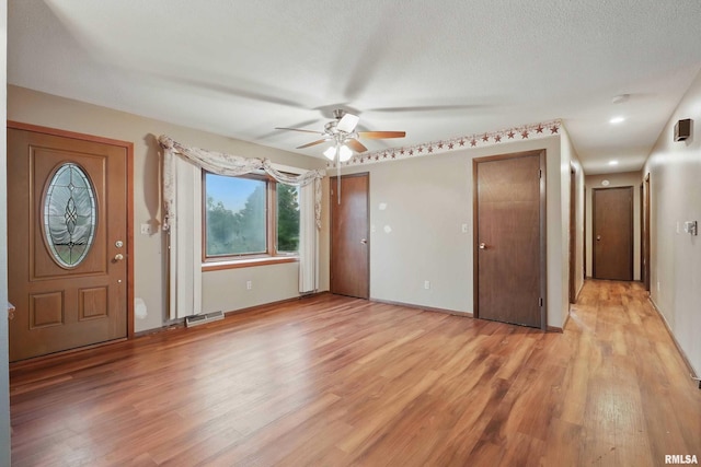 803 Locust St, Princeton, IA 52768 - entryway featuring ceiling fan, light wood-type flooring, and baseboards