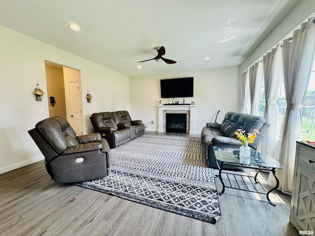11401 N Joseph St, Dunlap, IL 61525 - living area with wood finished floors, a ceiling fan, a fireplace, and recessed lighting