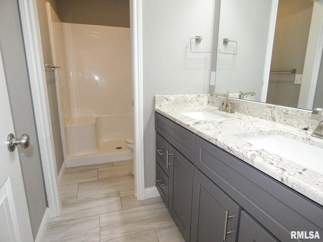 11401 N Joseph St, Dunlap, IL 61525 - bathroom featuring double vanity, baseboards, toilet, and walk in shower