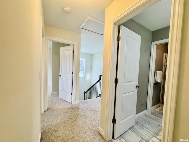 11401 N Joseph St, Dunlap, IL 61525 - hall featuring attic access, an upstairs landing, and light colored carpet
