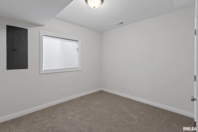 11401 N Joseph St, Dunlap, IL 61525 - empty room with electric panel, carpet floors, and baseboards