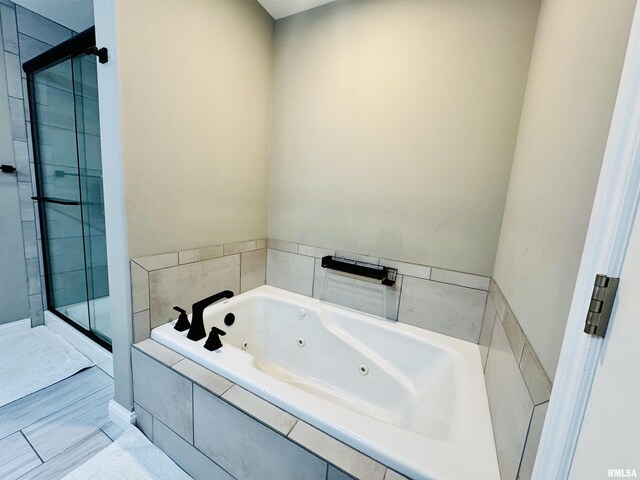 11401 N Joseph St, Dunlap, IL 61525 - bathroom featuring a shower stall and a jetted tub