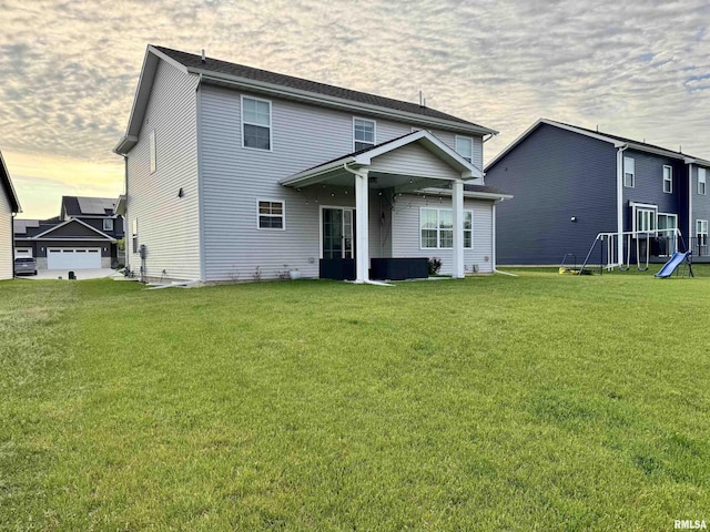 11401 N Joseph St, Dunlap, IL 61525 - rear view of house with a lawn and a playground