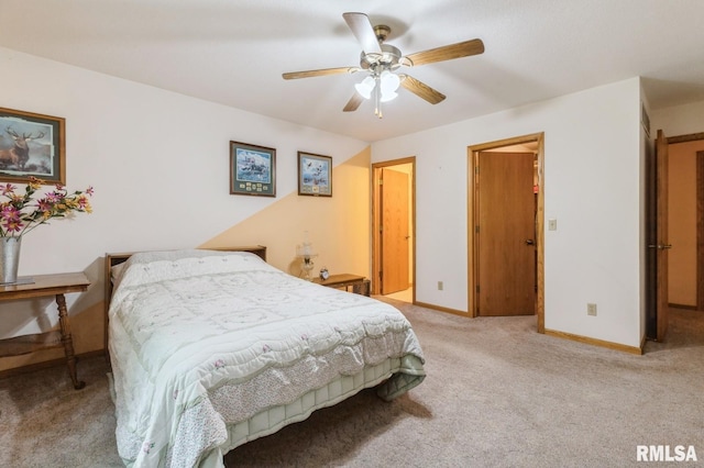 1530 N Pine St, Davenport, IA 52804 - carpeted bedroom featuring baseboards and ceiling fan