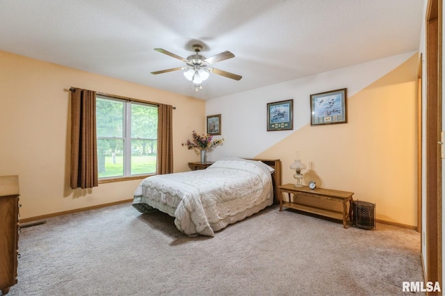 1530 N Pine St, Davenport, IA 52804 - carpeted bedroom featuring baseboards and a ceiling fan