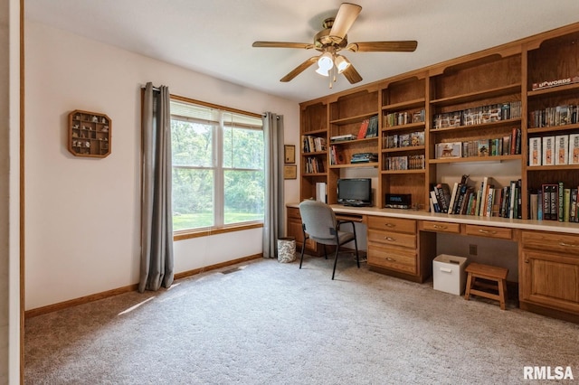 1530 N Pine St, Davenport, IA 52804 - office area with light colored carpet, ceiling fan, built in desk, and baseboards