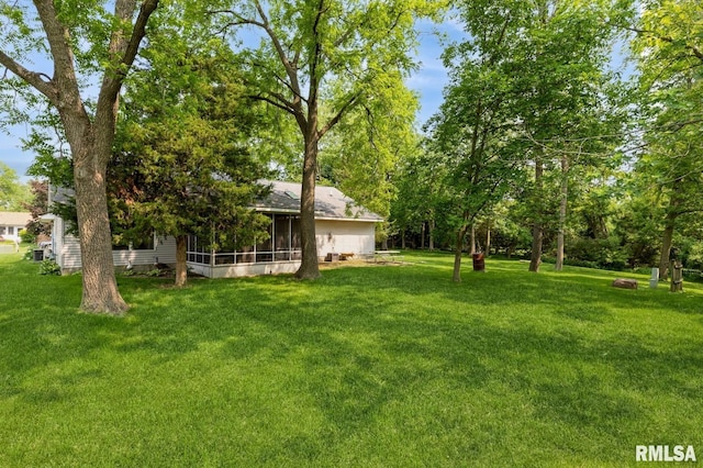 1530 N Pine St, Davenport, IA 52804 - view of grassy yard featuring a sunroom