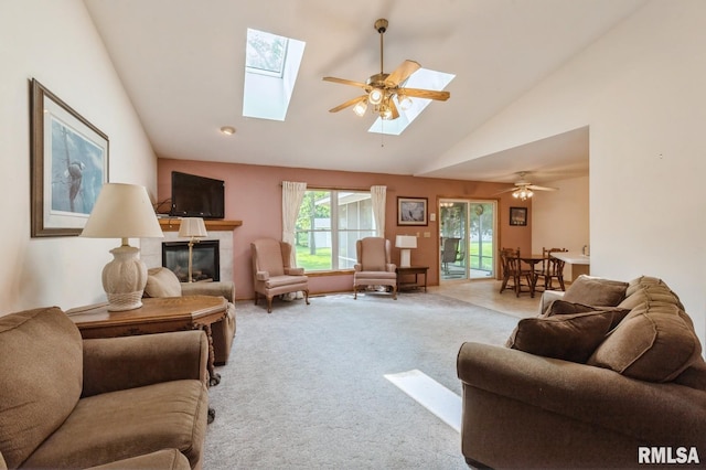 1530 N Pine St, Davenport, IA 52804 - living room with a skylight, a fireplace, carpet flooring, high vaulted ceiling, and ceiling fan