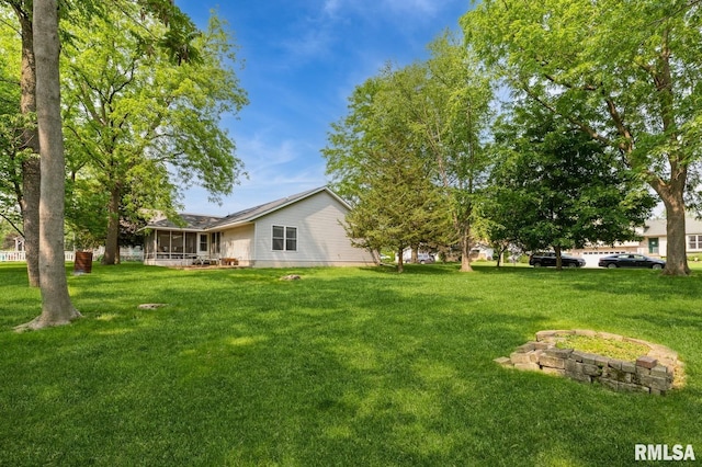1530 N Pine St, Davenport, IA 52804 - view of grassy yard with a sunroom