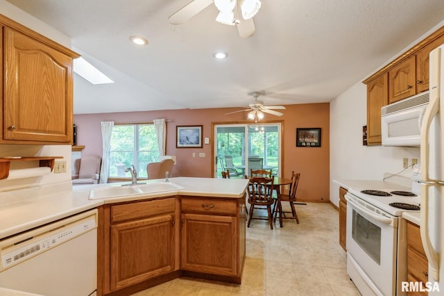 1530 N Pine St, Davenport, IA 52804 - kitchen with white appliances, a sink, ceiling fan, a peninsula, and recessed lighting
