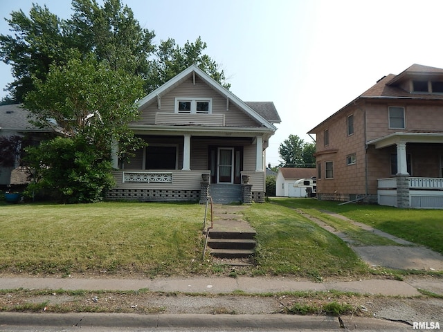 1115 W Locust St, Davenport, IA 52804 - view of front of house with a porch and a front lawn