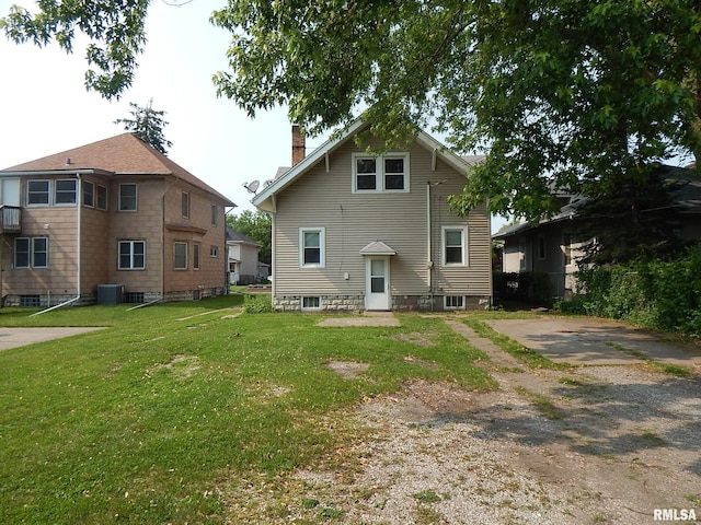 1115 W Locust St, Davenport, IA 52804 - back of house featuring a yard and a chimney
