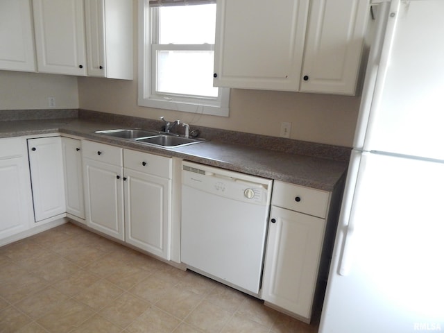 1115 W Locust St, Davenport, IA 52804 - kitchen featuring white appliances, a sink, white cabinets, and dark countertops