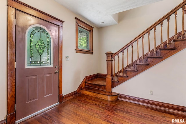 2723 Iowa St, Davenport, IA 52803 - entryway with baseboards, wood finished floors, and stairway