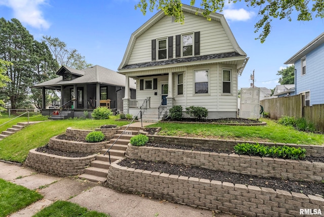2723 Iowa St, Davenport, IA 52803 - dutch colonial with a gambrel roof, a porch, stairway, and a shingled roof