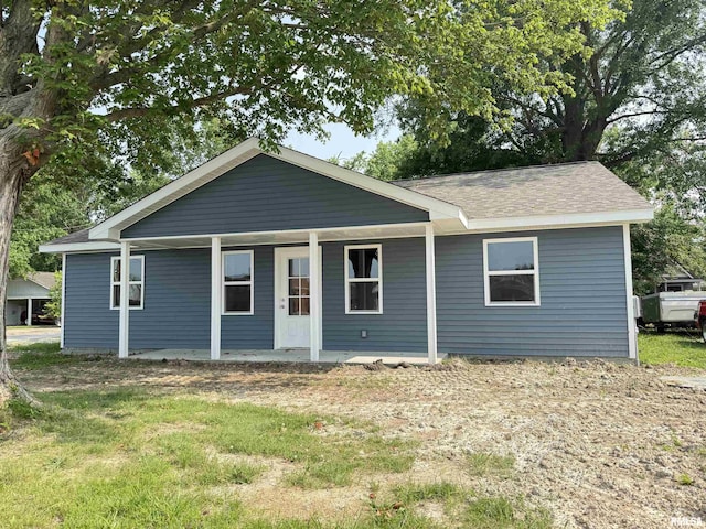 1609 W Chestnut St, Marion, IL 62959 - back of property featuring a yard and a shingled roof