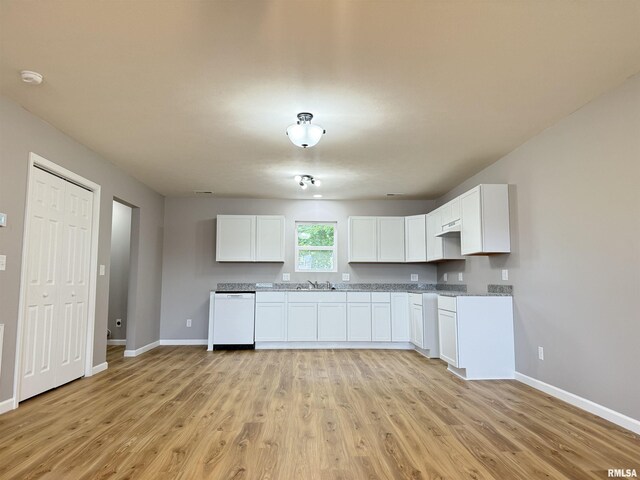 1609 W Chestnut St, Marion, IL 62959 - kitchen featuring dishwasher, baseboards, a sink, light wood-style flooring, and white cabinetry