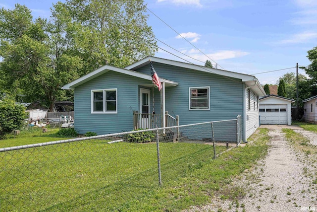 129 State St, Carbon Cliff, IL 61239 - bungalow featuring an outdoor structure and a detached garage