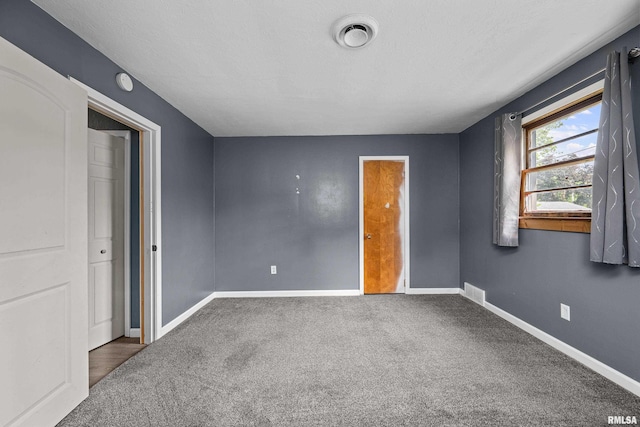 129 State St, Carbon Cliff, IL 61239 - unfurnished bedroom with carpet and baseboards