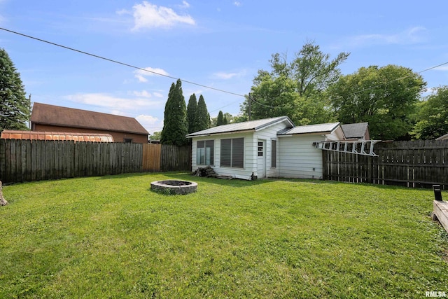 129 State St, Carbon Cliff, IL 61239 - view of yard with an outdoor fire pit