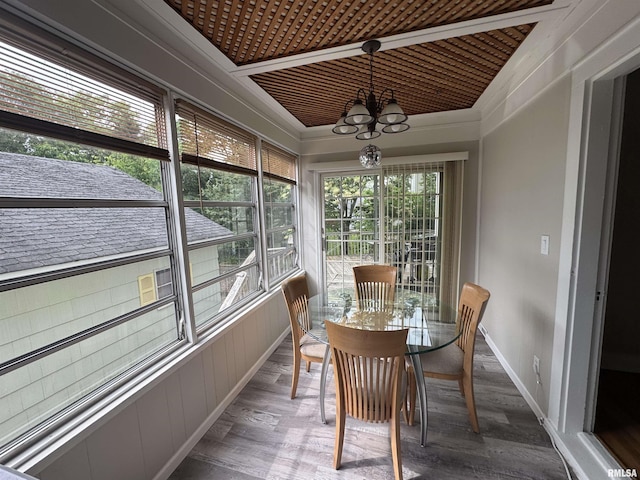 2139 10th St, East Moline, IL 61244 - sunroom featuring a chandelier