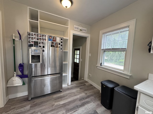 2139 10th St, East Moline, IL 61244 - kitchen with stainless steel fridge, open shelves, and wood finished floors