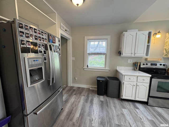 2139 10th St, East Moline, IL 61244 - kitchen featuring appliances with stainless steel finishes, white cabinets, wood finished floors, and open shelves