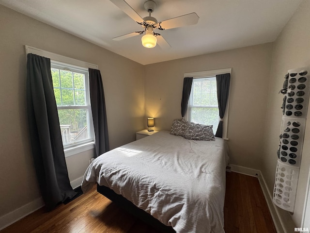 2139 10th St, East Moline, IL 61244 - bedroom with wood finished floors, baseboards, and ceiling fan