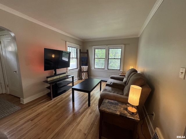 2139 10th St, East Moline, IL 61244 - living room with arched walkways, wood finished floors, baseboards, and ornamental molding