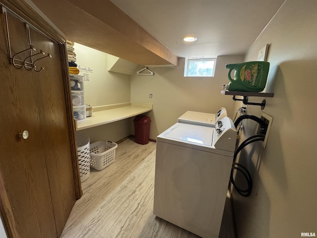 2139 10th St, East Moline, IL 61244 - washroom with light wood finished floors and separate washer and dryer