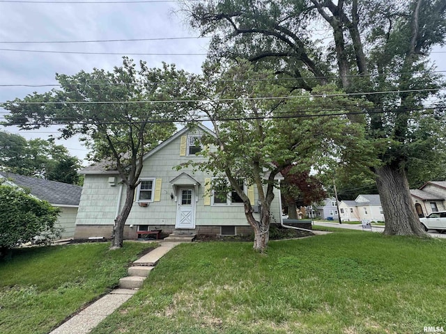 2139 10th St, East Moline, IL 61244 - bungalow-style house featuring a front yard and entry steps